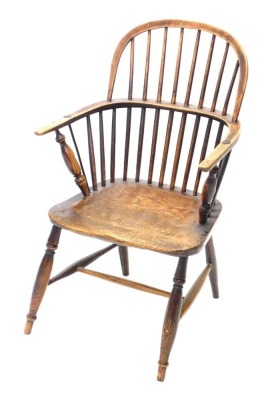 A 19thC ash and elm Lincolnshire Windsor chair, with plain spindle back, solid seat on turned legs, with H stretcher.