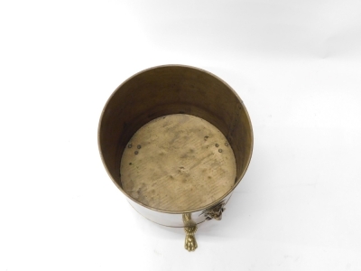 A 20thC brass coal bucket, with lion mask handles, partially studded on hairy paw feet, 41cm high, 37cm diameter. - 2