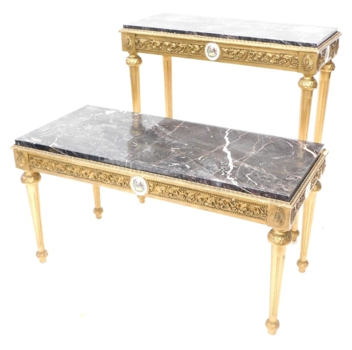 A French giltwood side table, with Limoges style medallion and scroll frieze, on turned tapering reeded legs, with sun patera above, 56cm high, 45cm deep, and another hall table. (2)