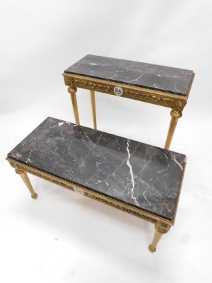 A French giltwood side table, with Limoges style medallion and scroll frieze, on turned tapering reeded legs, with sun patera above, 56cm high, 45cm deep, and another hall table. (2) - 2