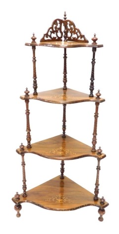 A 19thC graduated serpentine four tier whatnot, with turned supports, on shaped feet, with a carved gallery, 139cm high.