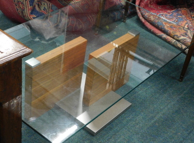 A retro teak metal and glass coffee table, of rectangular form, with a stepped centre section, 40cm high, 120cm wide, 77cm deep.