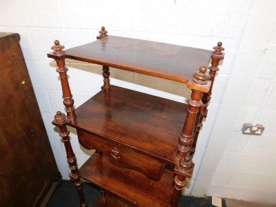 An unusual continental walnut four tier whatnot, with central frieze drawer on turned supports, 46cm deep. - 2