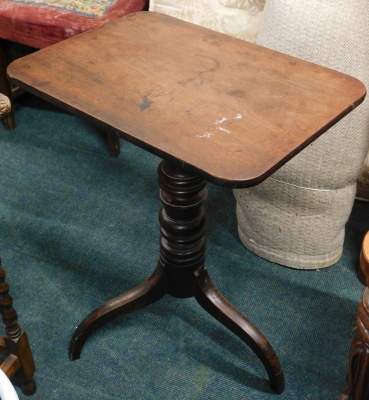 A 19thC mahogany tilt top table, the oblong top on turned stem, terminating in triple sabre legs, 74cm high, 59cm wide, 46cm deep.