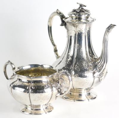 A Victorian silver two piece coffee service, comprising coffee pot with acanthus leaf handle, leaf and floral knop, bellied body, melon shaped foot etched with scrolls and flowers with an acanthus leaf spout, London 1847 and a matching two handled sugar b