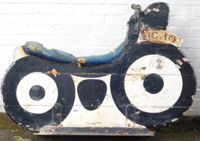 A fairground ride wooden motorcycle, marked IC.18, painted in white and black, on metal framed base with metal handles, various coloured leather studded seat, 94cm high, 112cm wide, 40cm deep. (AF)