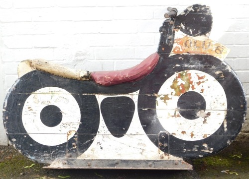 A fairground ride wooden motorcycle, marked OLU.8, painted in white and black, on metal framed base with metal handles, various coloured leather studded seat, 94cm high, 112cm wide, 40cm deep. (AF)