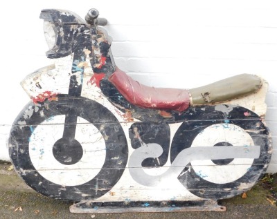 A fairground ride wooden motorcycle, painted in white and black, on metal framed base with metal handles, various coloured leather studded seat, 94cm high, 112cm wide, 40cm deep. (AF) - 2