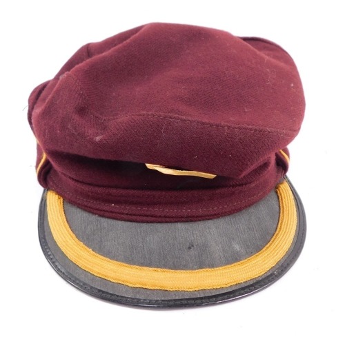 A railway conductor's cap, in maroon with gold border and applied railway badge, numbered 28/321GN.