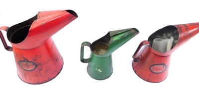 Three Esso oil cans, comprising two red oil cans stamped Esso, 31cm and 26cm high, and a green quart Esso jug, 28cm high. (3)