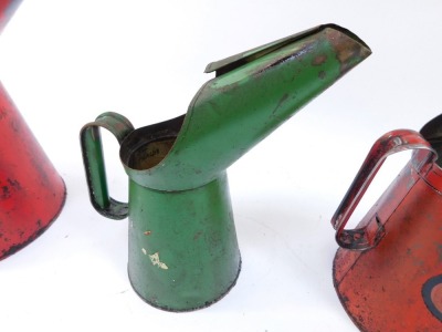 Three Esso oil cans, comprising two red oil cans stamped Esso, 31cm and 26cm high, and a green quart Esso jug, 28cm high. (3) - 3