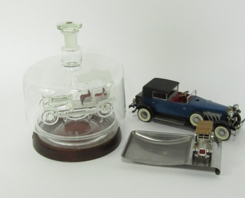 Automobilia trinkets, comprising a glass car in case, ashtray with car emblem and a battery powered model car. (3)