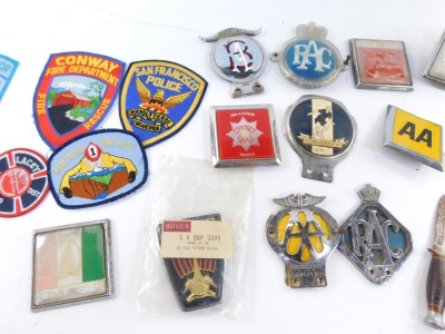 A group of motor racing badges, comprising San Francisco Police, Fire Inspection, Surrey Fire Brigade Drill Section, a Ford domestic bezel part, various fire and rescue badges, a Rover car badge, etc. (a quantity) - 3