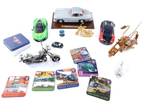 A group of toy cars, comprising a Burago Mercedes Benz 300SL, on stand, a wooden Harley Davidson model, a Quick Build McLaren P1, a nuts and bolts motorbike, diecast Mini, other collectables, etc. (1 tray)