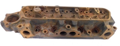 A cast cylinder head block, 45cm wide.