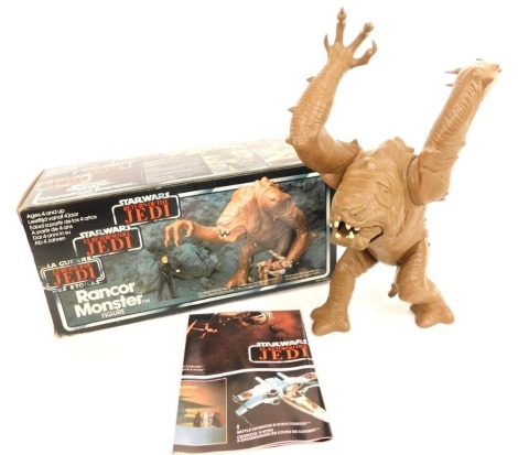 A Star Wars Palitoy Return of the Jedi Rancor figure, partial French lettering, 1983 copyright. (boxed)