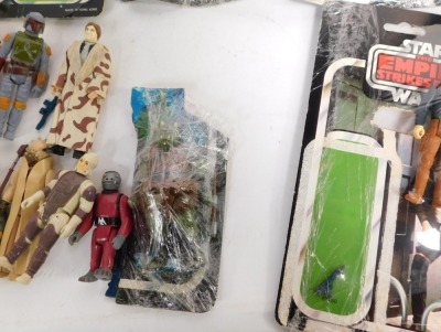 Various Star Wars Palitoy Empire Strikes Back figures, Luke Skywalker, Princess Leia in Bespin gown, Luke in Bespin fatigues, Tusken Raider, Dengar, Storm trooper, Hans Solo in Bespin outfit, FX-7, Boba Fett and Obi-Wan Kenobi, with part card backings. (a - 5