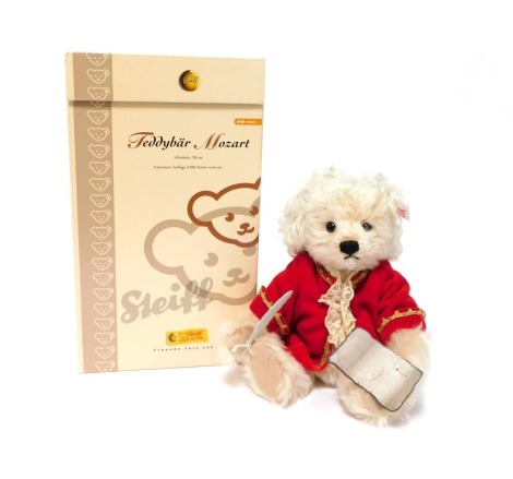 A Steiff Mozart teddy bear, ivory, 28cm high, limited edition, boxed.