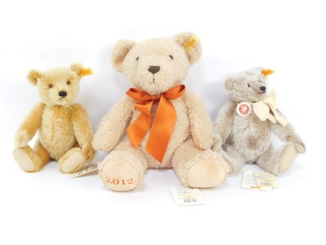 Three Steiff teddy bears, including the Classic teddy bear, 26cm high, teddy bear, 25cm high, and the 2012 Cosy bear. (3)