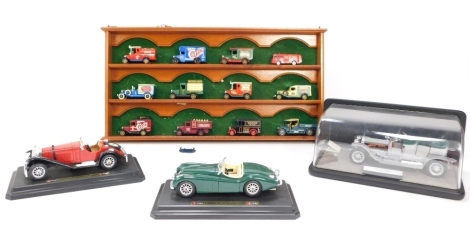 A Franklin Mint 1907 Rolls Royce Silver Ghost, Burago Mercedes Benz SSK, Jaguar XK 120 Roadstar, Matchbox die cast vehicles and a hanging display case. (a quantity)