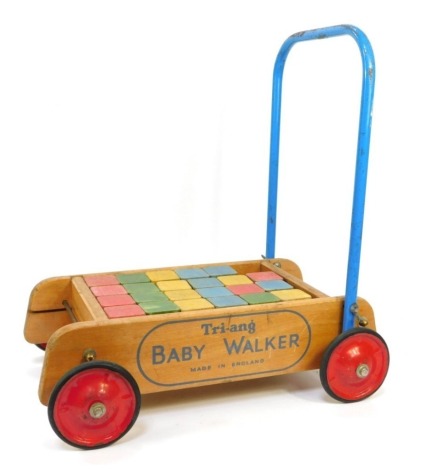 A Tri-ang baby walker, with blocks. (AF)