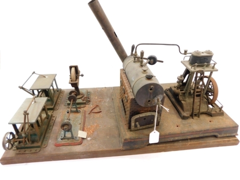 A Doll Toy Company Live Steam engine, model 360/4, with Mamod grinding wheel, Mamod band saws, and Mamod lathe.