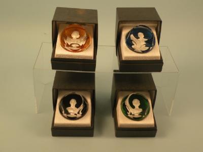 A set of four Baccarat sulphide paperweights