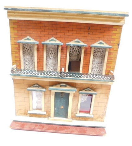 A mid 20thC Georgian style dolls house, with fixed roof, open windows, and fixed door, and a small quantity of accessories, 60cm high.