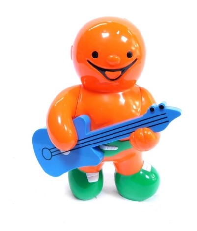 A 20thC plastic Jelly Baby money box, the figure playing guitar, in blue orange and green, 28cm high, and a group of Teddy Bears. (a quantity)