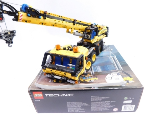 A Lego Technics set 42108 lifting crane, made with instructions, boxed.