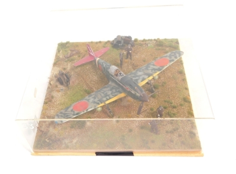 A cased diorama model of a Kawasaki KI61 Tony Hein Fighter, in 1:32 scale.