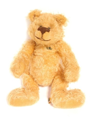 A Steiner blonde plush jointed Teddy bear, 28cm high.