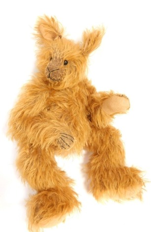 A 20thC blonde plush jointed Teddy bear, 28cm high.