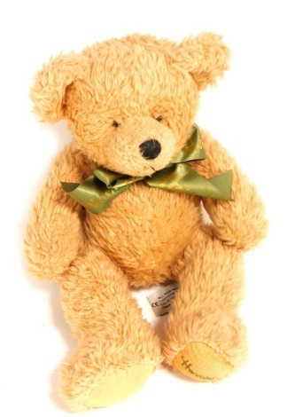 A Harrods blonde plush jointed Teddy bear, 34cm high.