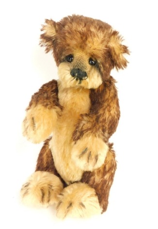 A 20thC cinnamon and blonde plush jointed Teddy bear, 20cm high.