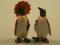 A Beswick figure of a penguin with an orange parasol and a figure of a