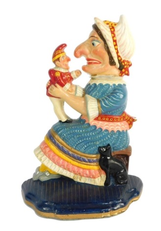 A decorative Punch & Judy Judy resin doorstop.