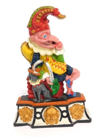 A Mr Punch cast iron door stop, profusely decorated predominantly in pink, red and green, 37cm high.