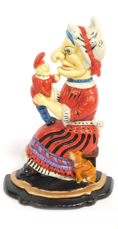 A Punch & Judy Judy door stop, profusely decorated predominantly in red, blue and black, 35cm high.