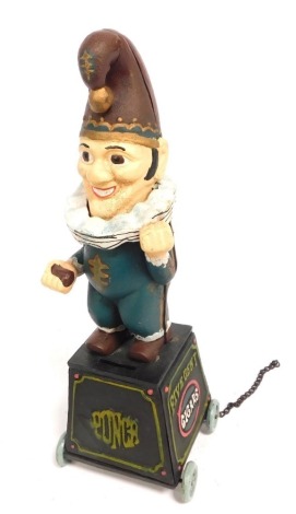 A modern Mr Punch pull along money box, on wheels, 32cm high.