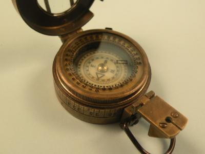 A brass military compass stamped TG Co Ltd London 1941