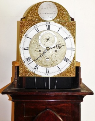 A George III mahogany longcase clock by Joseph Wood of Scarborough, the arched dial with foliate spandrels, silver chapter ring bearing Roman and Arabic numerals, subsidiary seconds dial and date aperture, eight day four pillar movement with bell strike, - 3