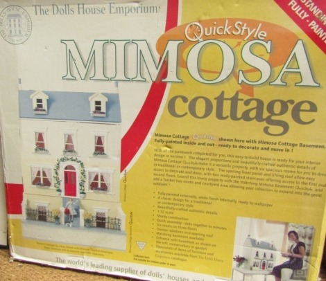 A Quickstyle Mimosa dolls house Emporium Cottage, partially boxed, with accessories.