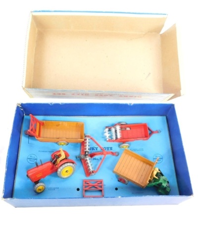 A Dinky Toys Farm Gear gift set, to include tractor and other accessories, partially boxed.