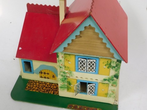 A modern wooden dolls house, with fixed roof, open front, and open interior, 45cm high, 44cm wide, 29cm deep.