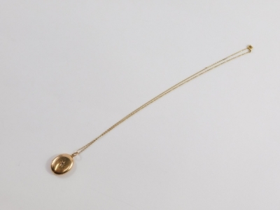 A 15ct gold locket, 3cm high, on a slender link chain, with plain interior, 7g all in. - 5