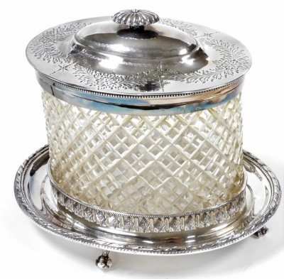 A Victorian cut glass biscuit barrel, with plated mount and hinged lid, engraved with flowers and ferns, on a galleried oval plated stand, raised on ball and claw feet, 21cm wide, together with a Victorian silver plated entree dish, with domed cover, rais - 2