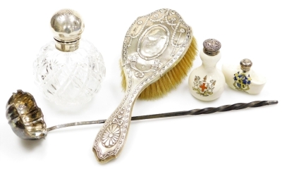 A group of silver, a silver topped cut glass scent bottle, of globular form, the lid monogrammed, Birmingham 1902, 12cm high, a silver mounted hair brush with monogrammed cartouche, decorated with flowers, bows, swags, etc, Birmingham 1908, two ceramic cr