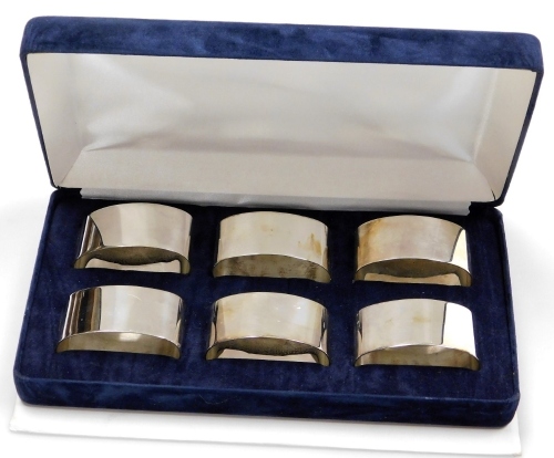 A set of six Elizabeth II silver napkin rings, of oval plain form, Sheffield 1998, 6¼oz, in fitted box with slip case.