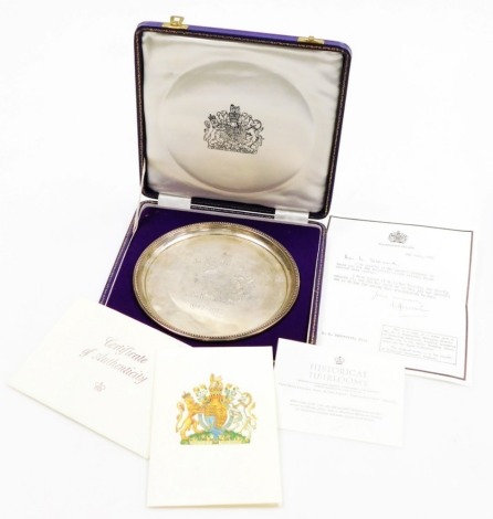An Elizabeth II silver salver, with a raised bead border, the centre engraved with the Queen's coat of arms and the date 1947-1972, Birmingham 1971, made to commemorate the silver wedding anniversary of Her Majesty the Queen and HRH The Prince Philip Duke